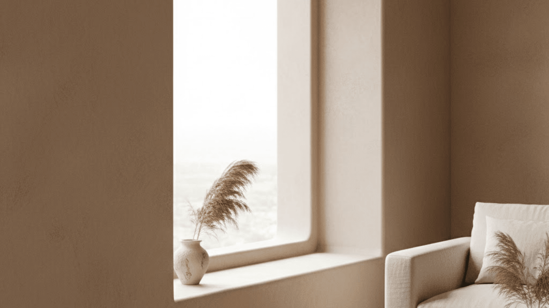 Soft beige trimless window design with curved edges and neutral modern interior decor