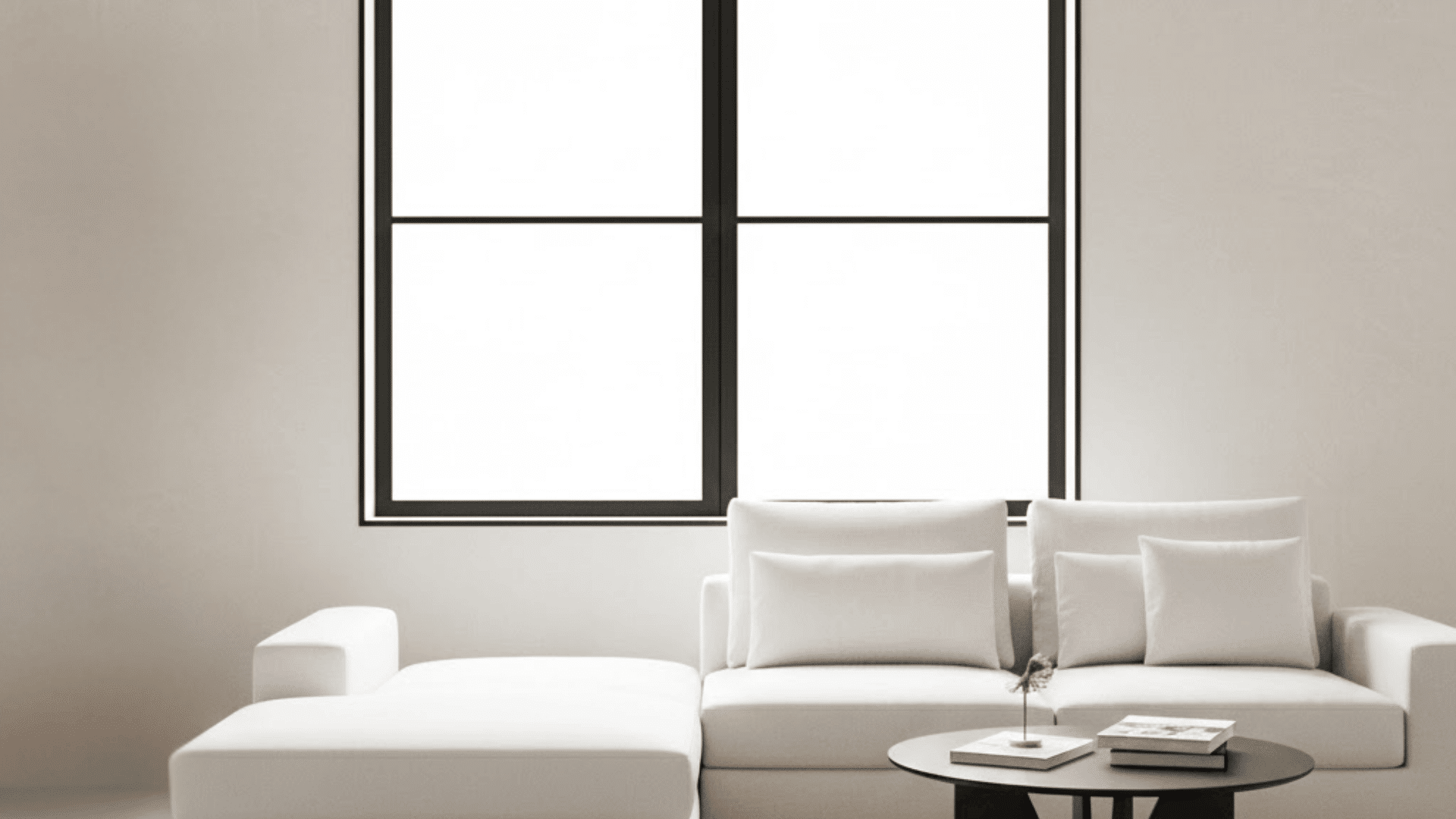 Matte black minimalist window trim above white modern sofa in clean contemporary living room