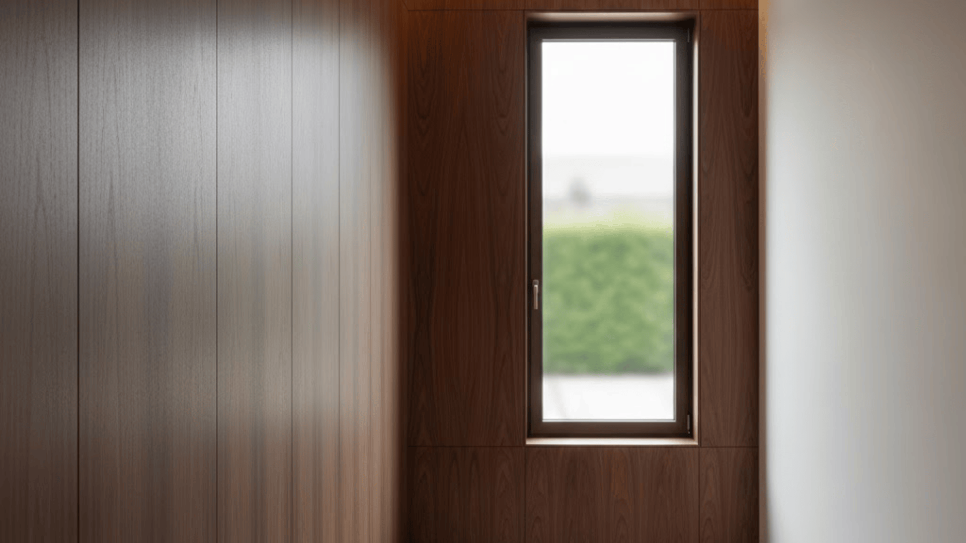 Slim modern window with dark wood veneer wall panels and narrow black interior window frame
