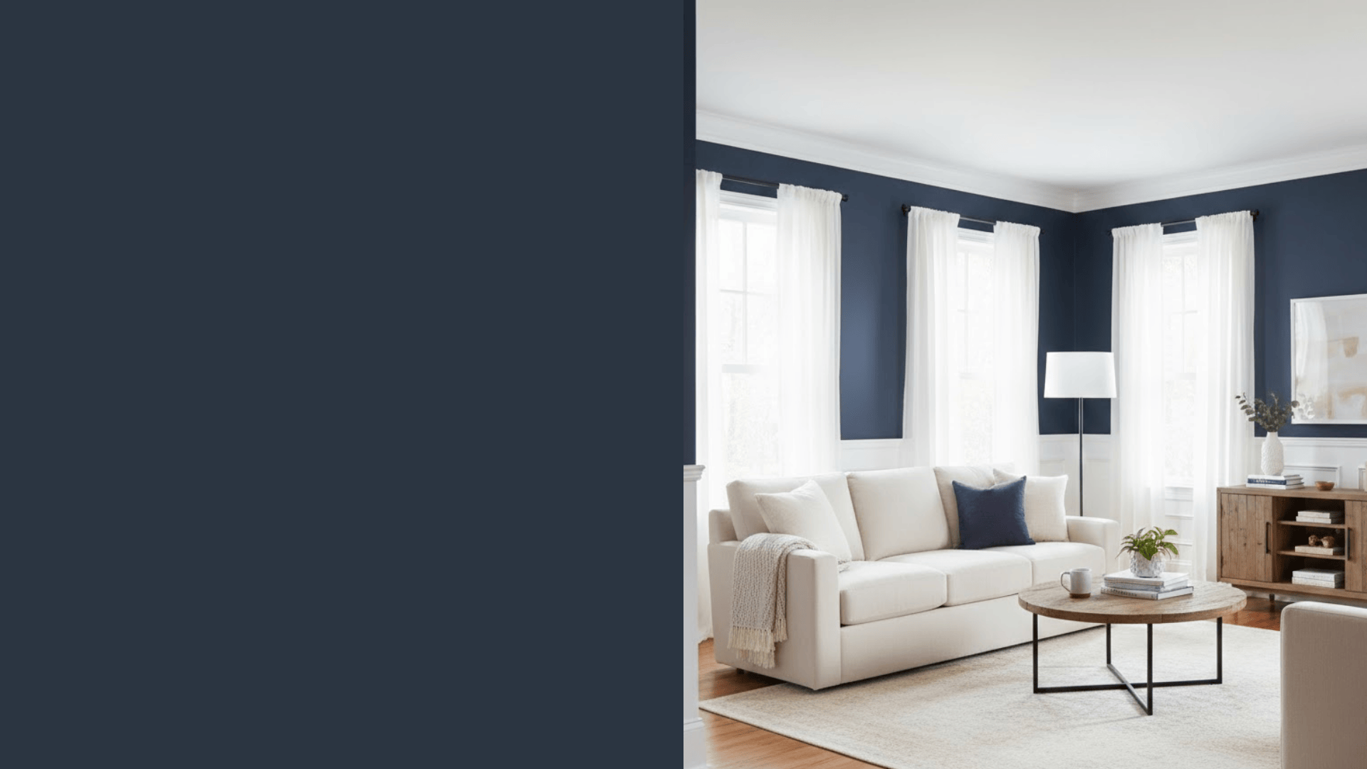 living room with warm wood floors and pure navy walls paired with white trim