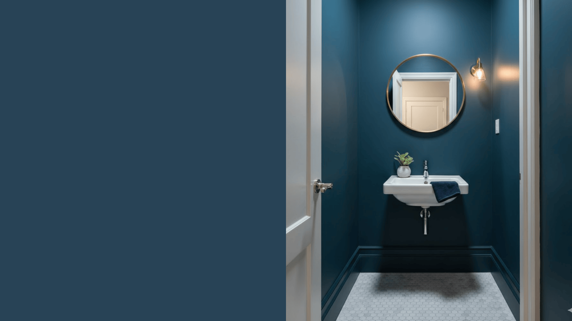 small powder room painted in blue green navy that feels intimate not cramped